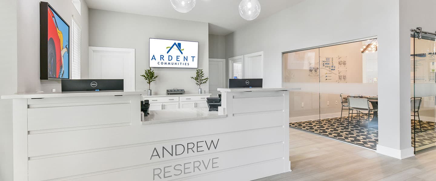 Front desk and community room with modern decor.