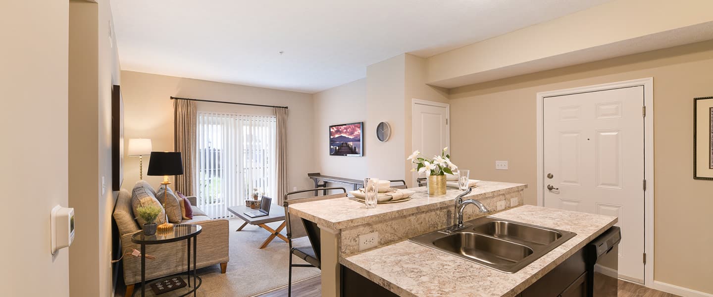An open kitchen layout complete with updated appliances and modern decor.