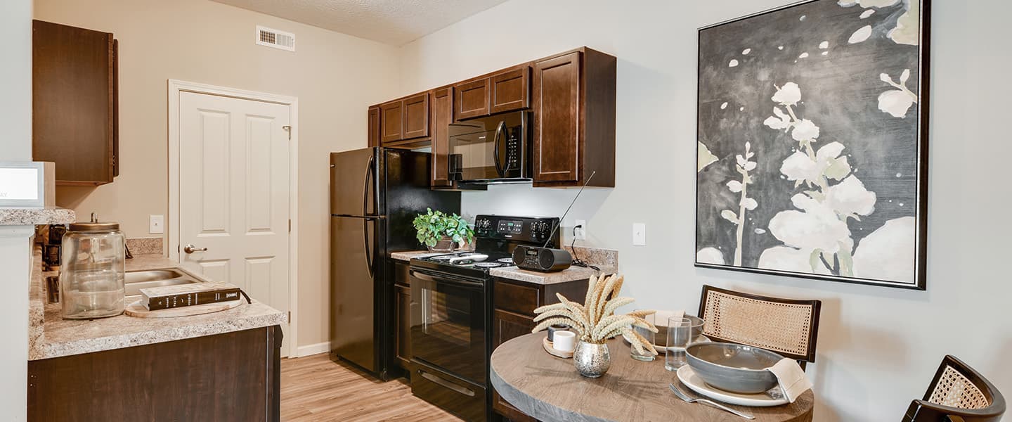 An open kitchen layout complete with updated appliances and modern decor.