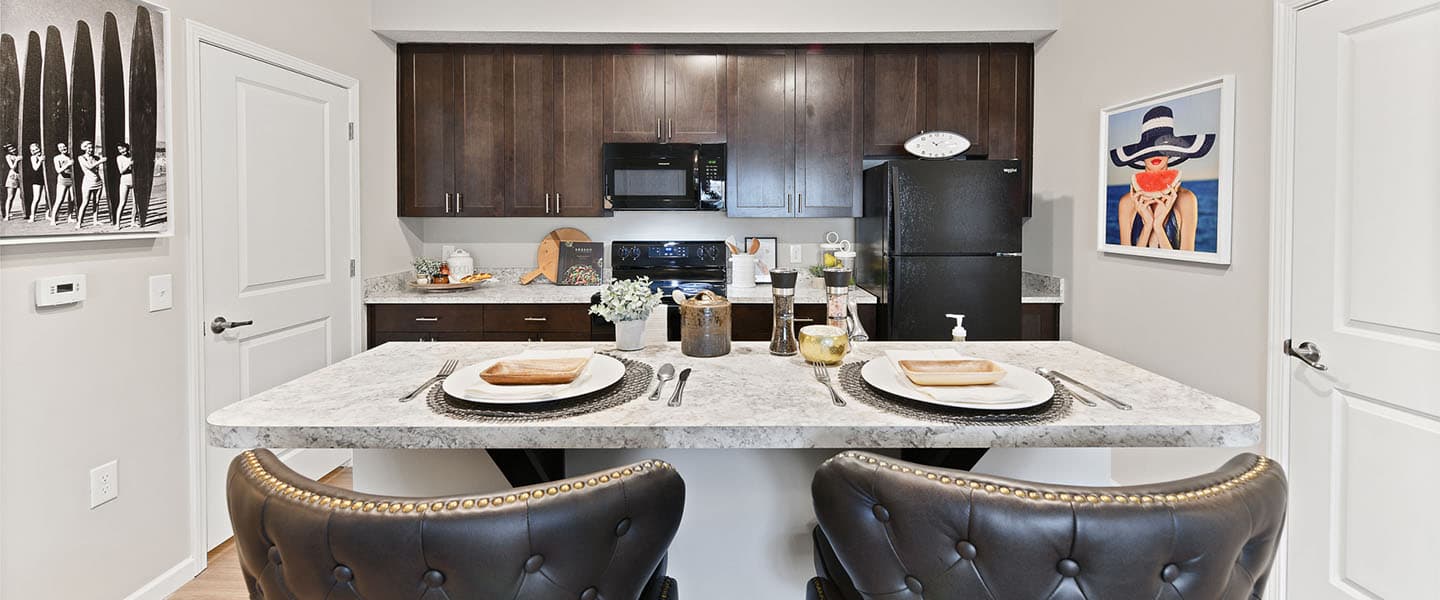 An open kitchen layout complete with updated appliances and modern decor.
