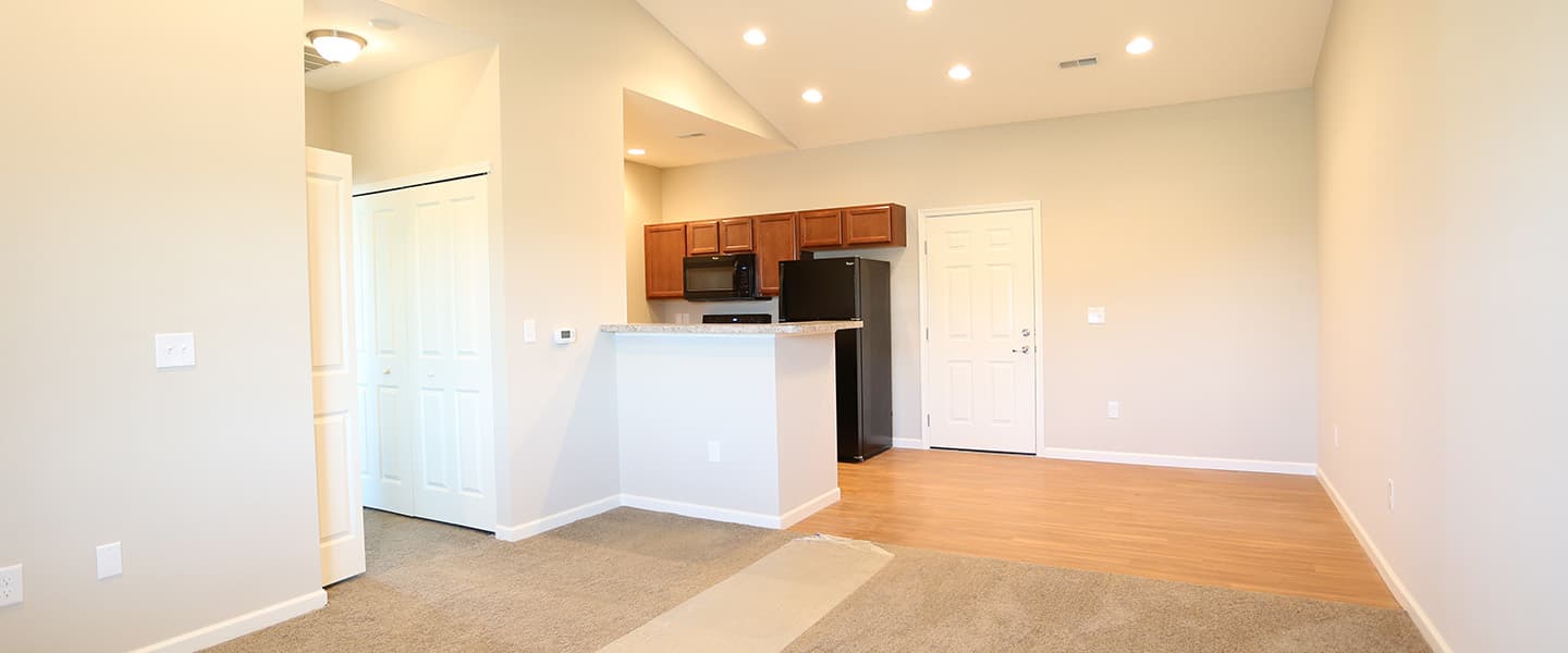 An open kitchen layout complete with updated appliances and modern decor.