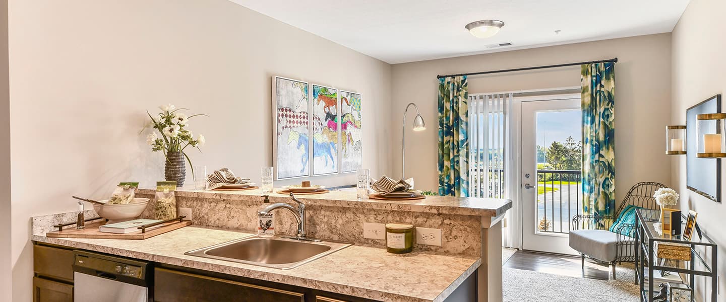 An open kitchen layout complete with updated appliances and modern decor.