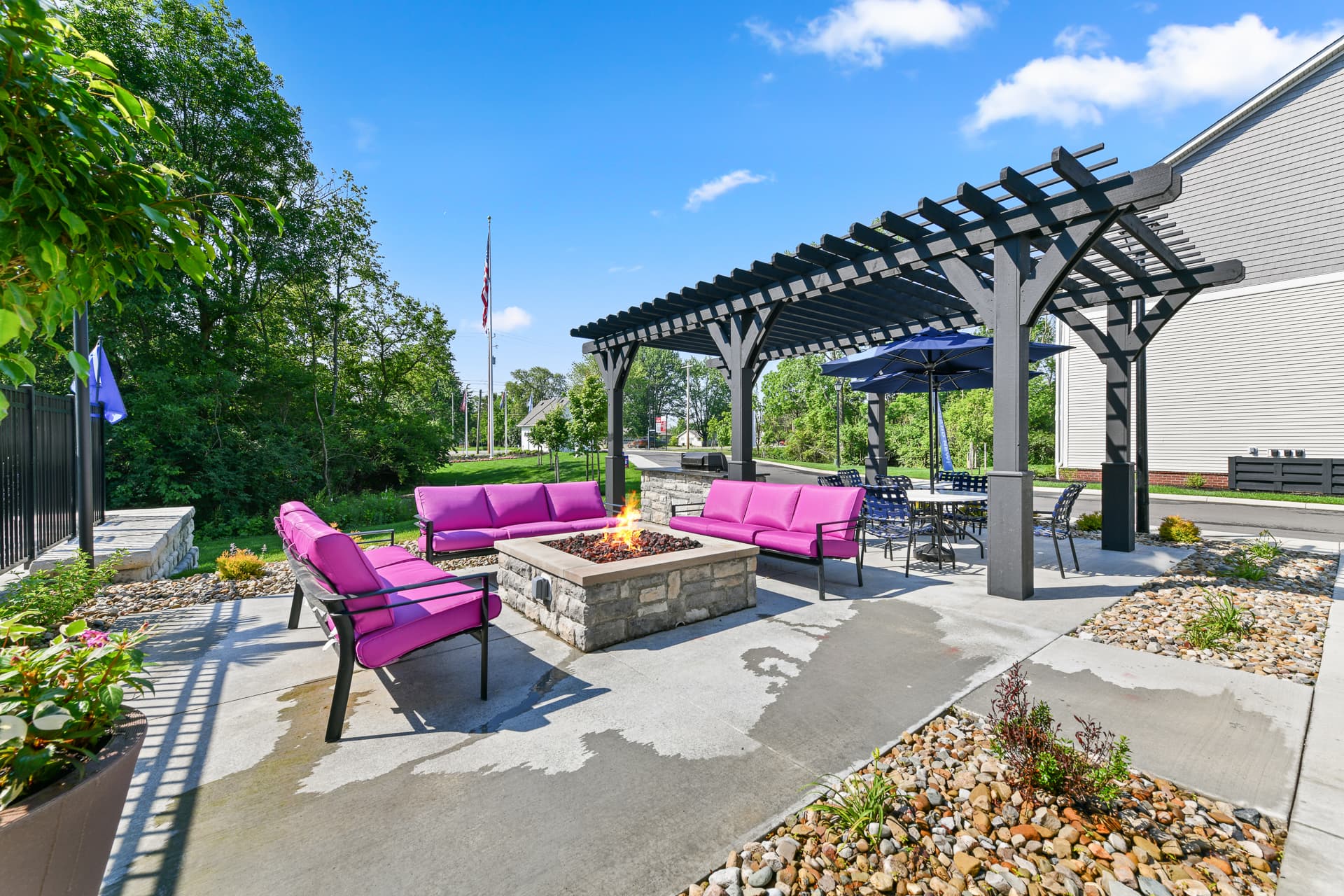 Patio with firepit at Alkire Meadows offering an inviting outdoor space for residents to relax.