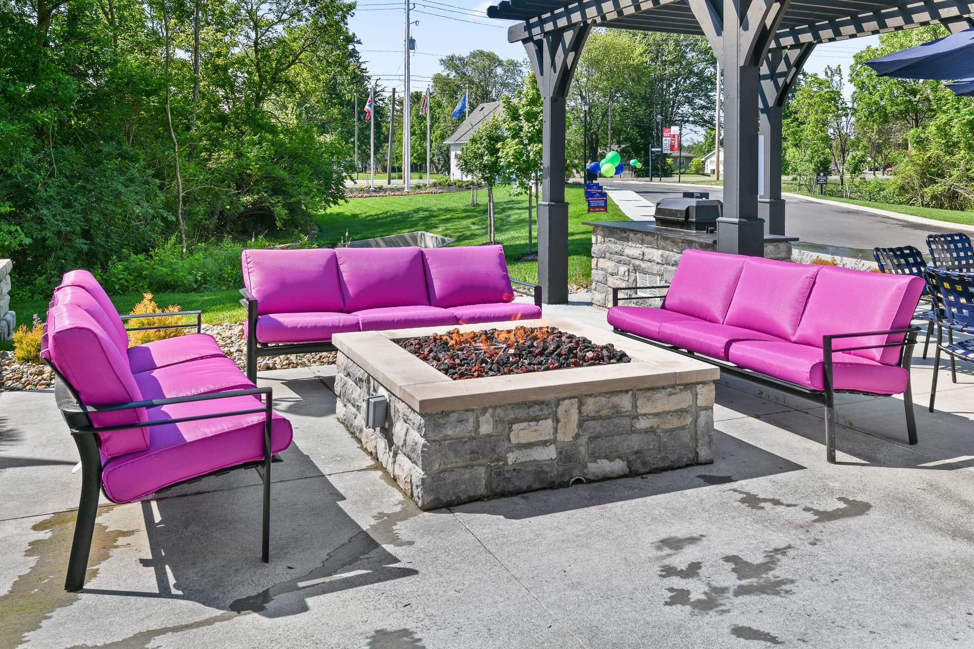 Community outdoor seating next to a firepit