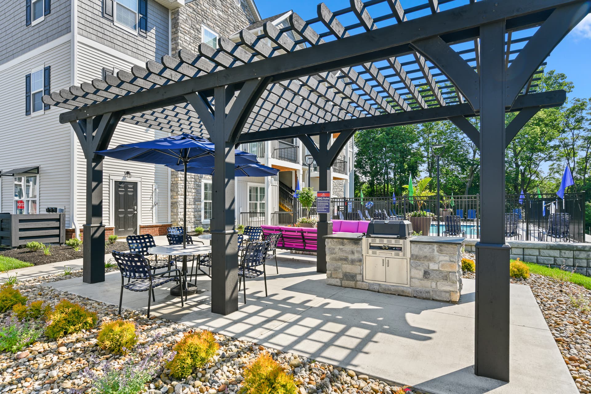 Patio area with seating and an outdoor grill
