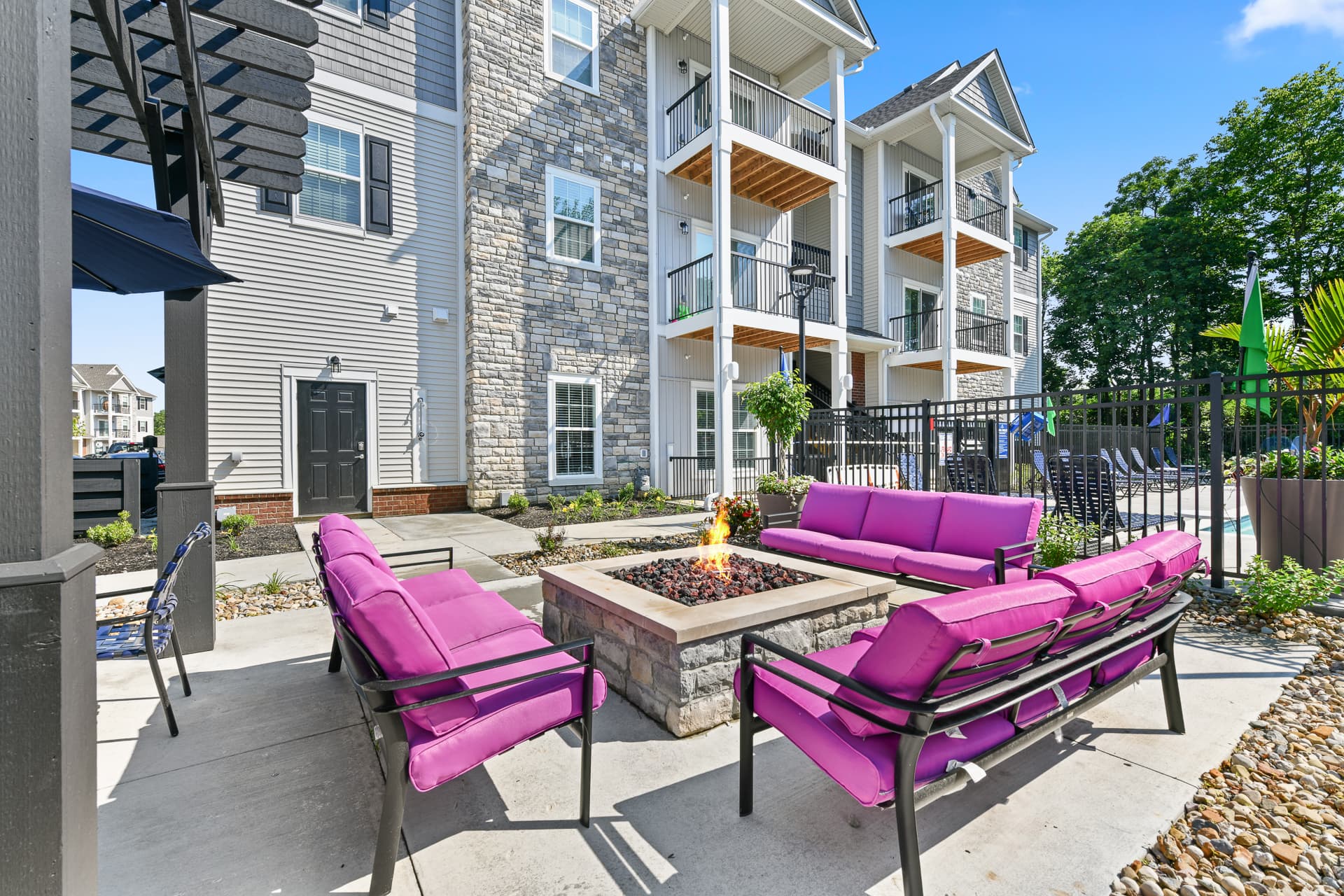 Patio area with firepit next to a gazebo