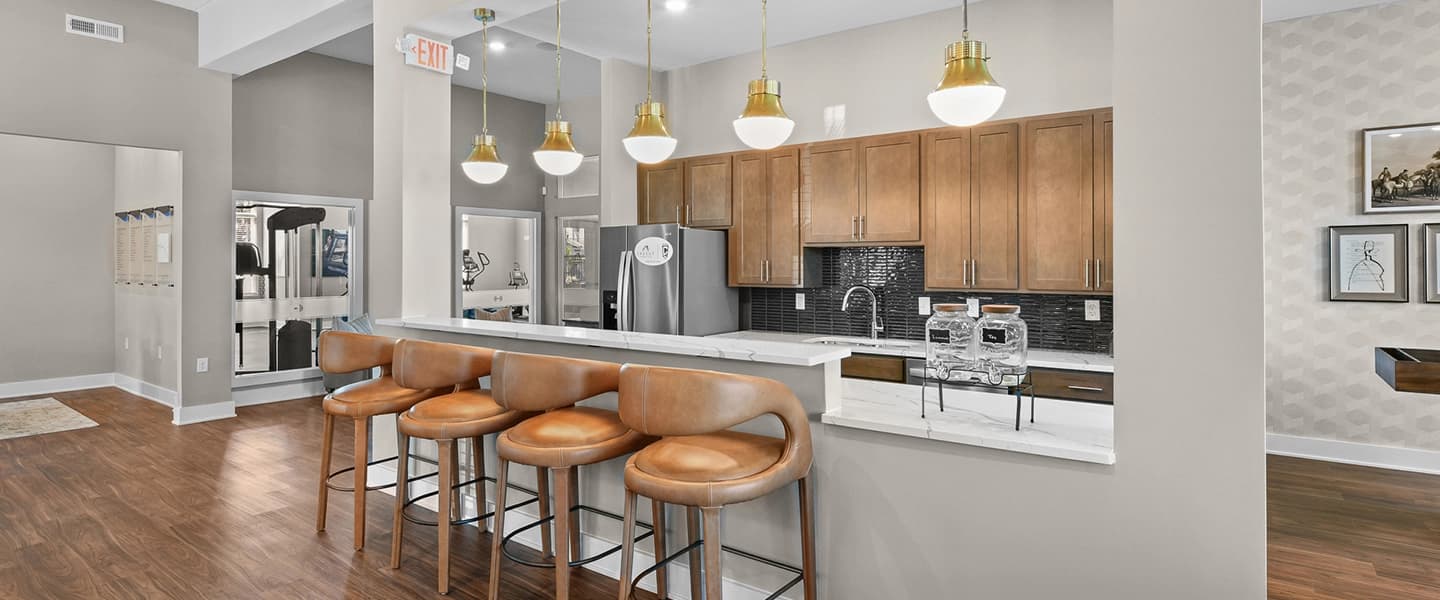 Community area featuring island seating with a kitchen for resident gatherings