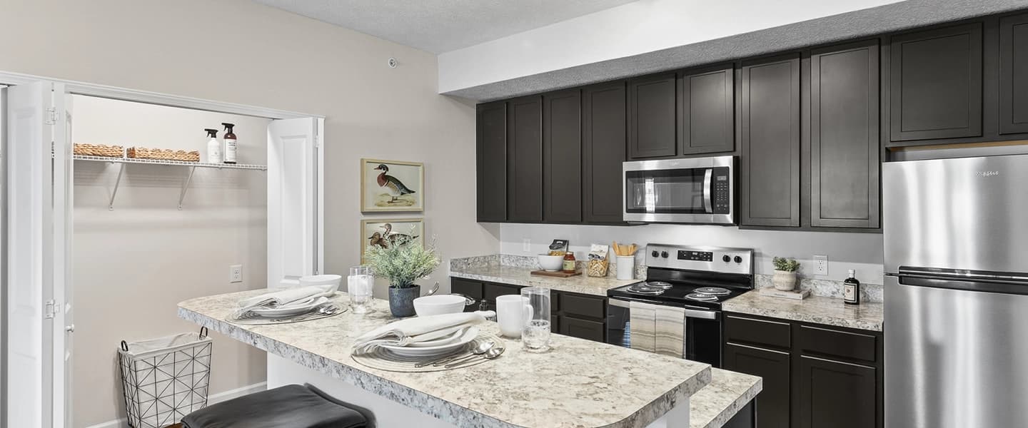 Kitchen with island, stainless steel finishes, and storage space